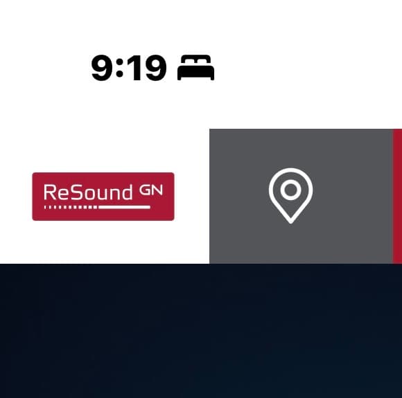 Digital clock showing 9:19, bed icon, red ReSound GN logo, and white location pin.