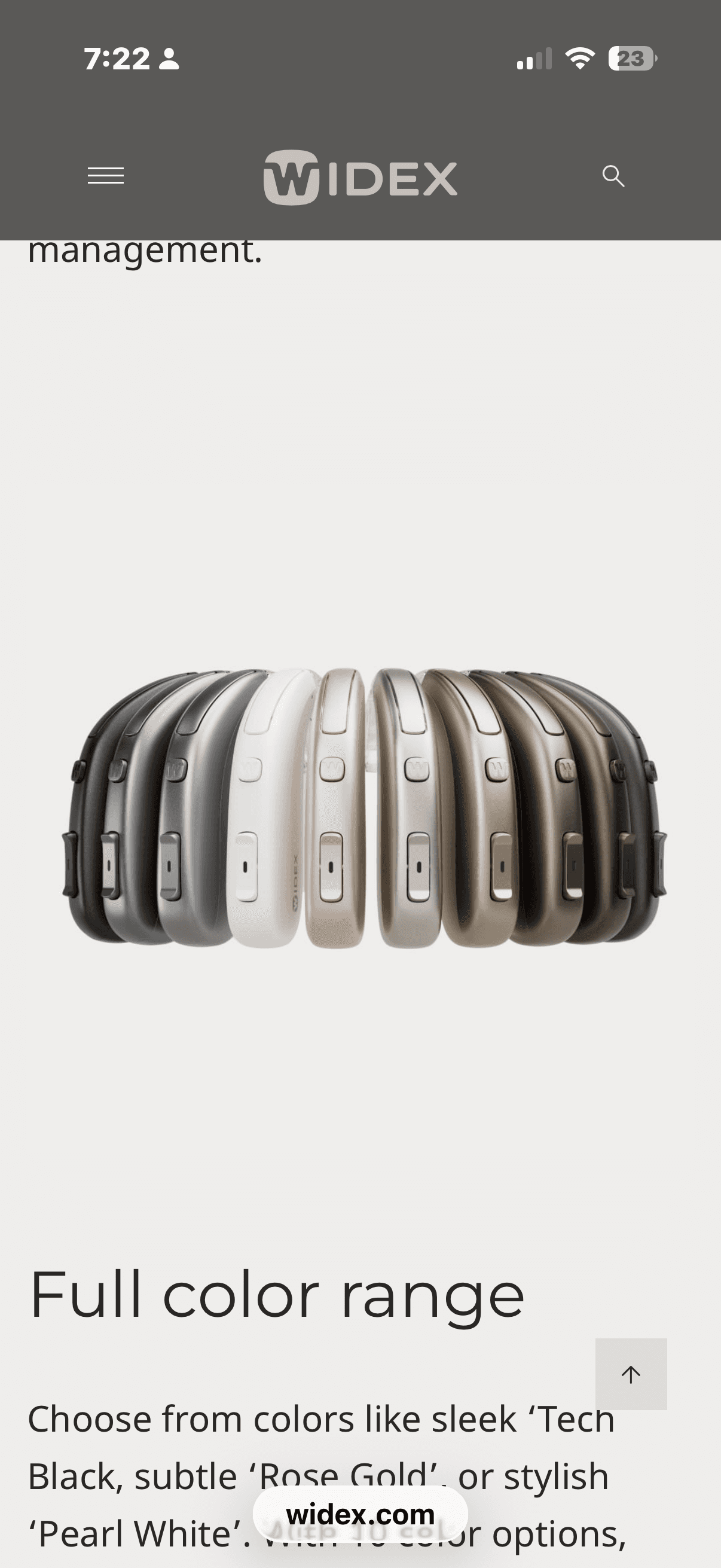 Widex hearing aids arranged in a row, showcasing a full range of available colors.